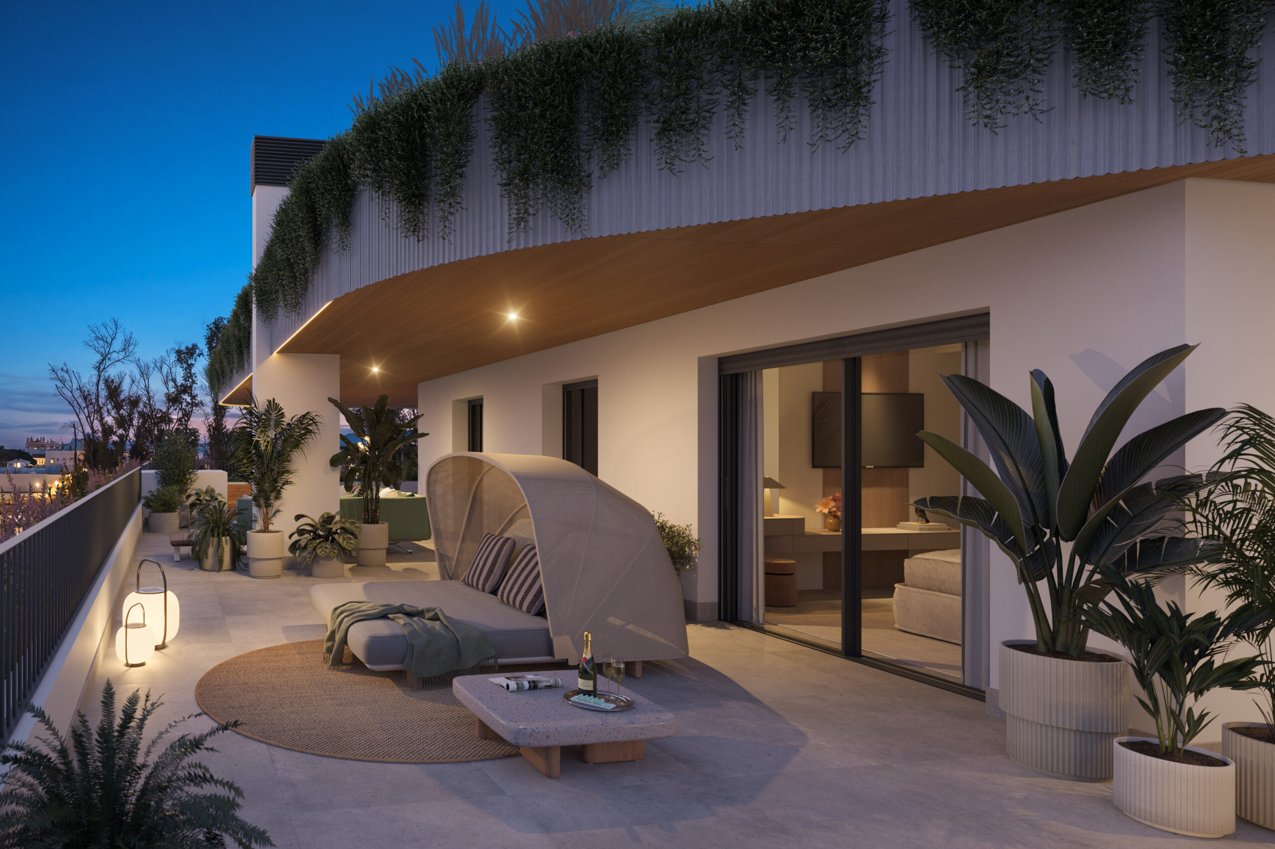 Terraza exterior con iluminación cálida al atardecer en vivienda de lujo